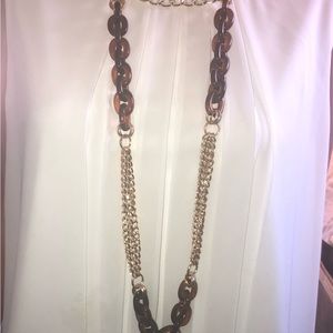 Costume necklace of golden and amber -colored links.